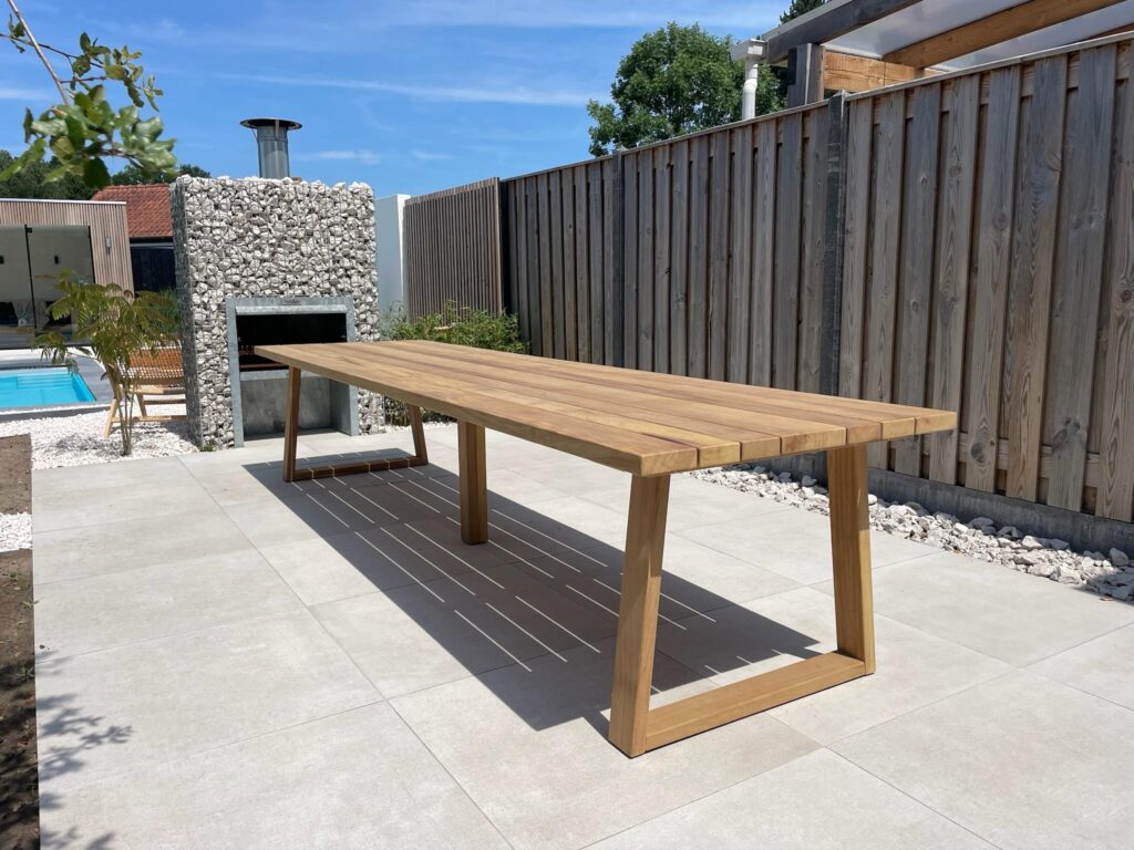 a wooden table on a patio